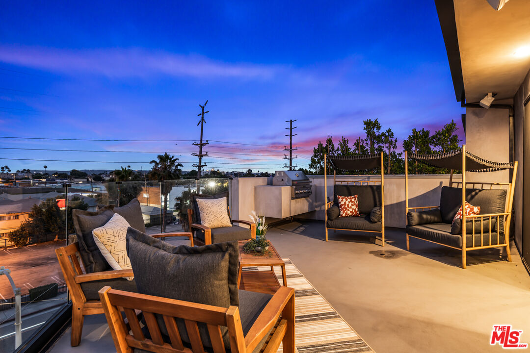 a view of a terrace with chairs