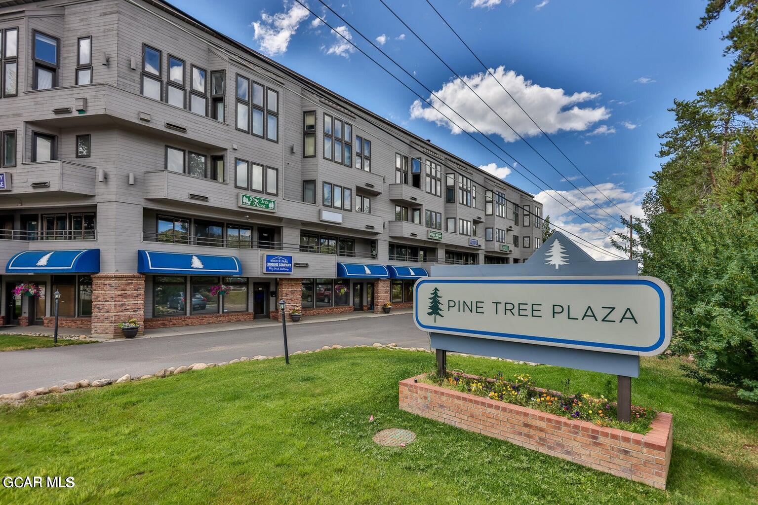 a view of a building with a garden and plants