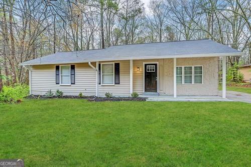 front view of a house with a yard