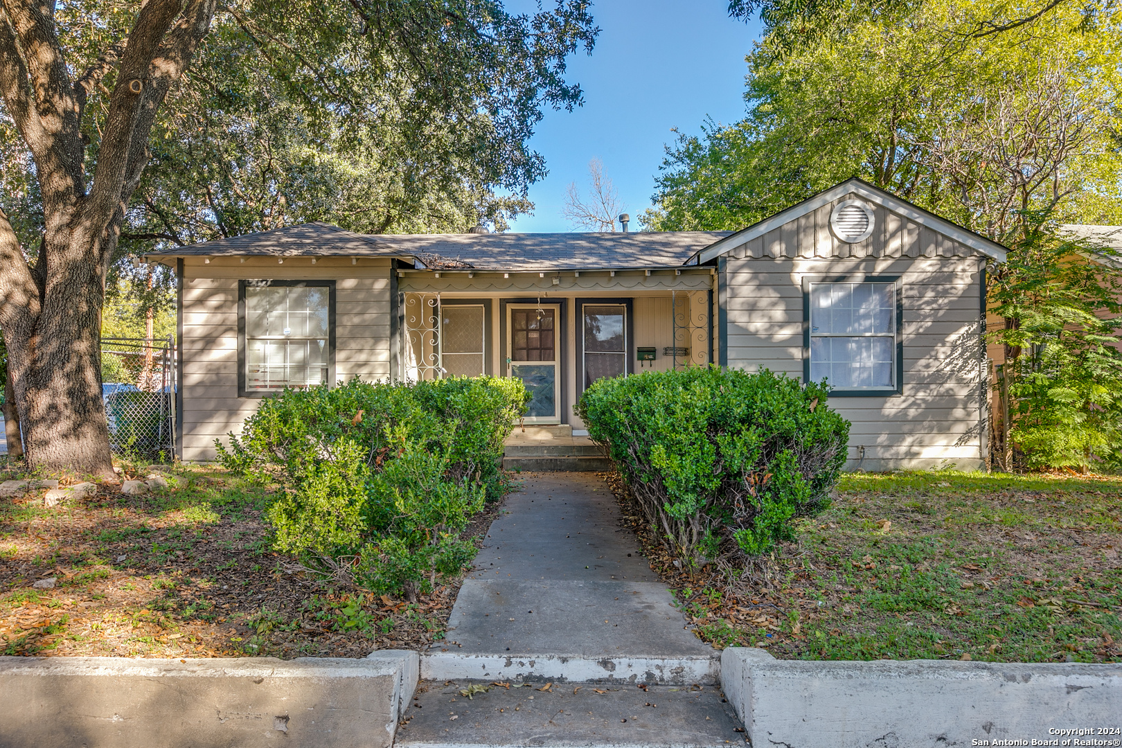 front view of a house with a yard