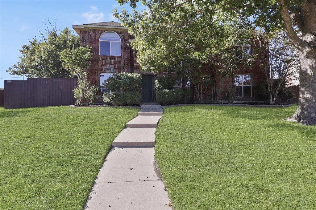 a house with garden in front of it