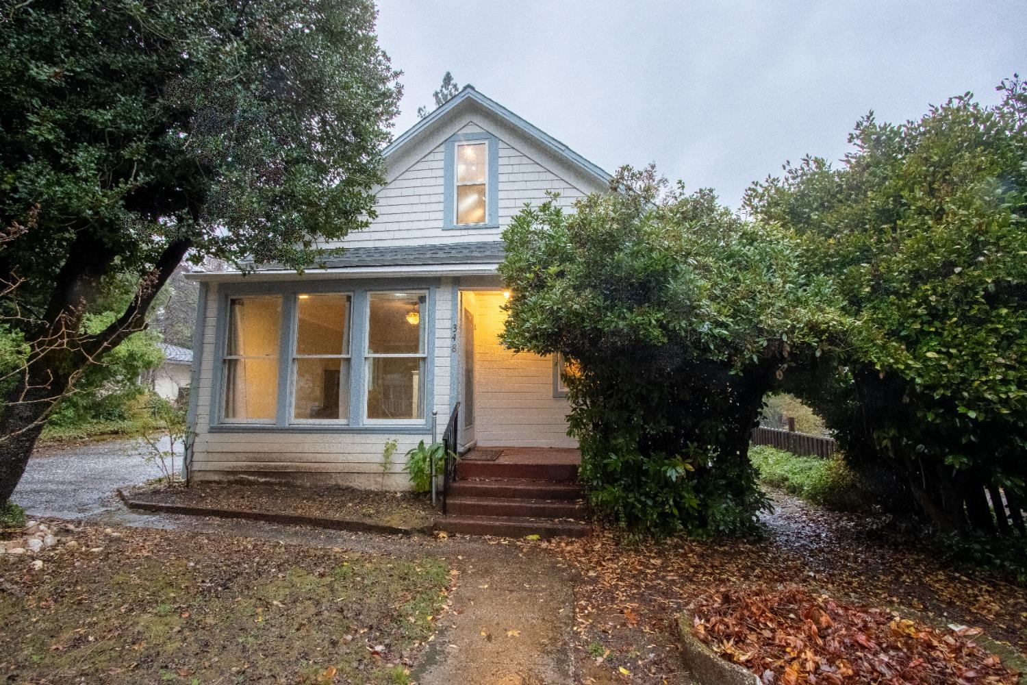 a front view of a house with garden