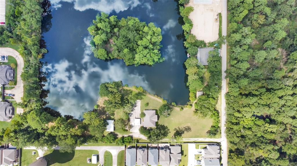 an aerial view of a residential house with outdoor space