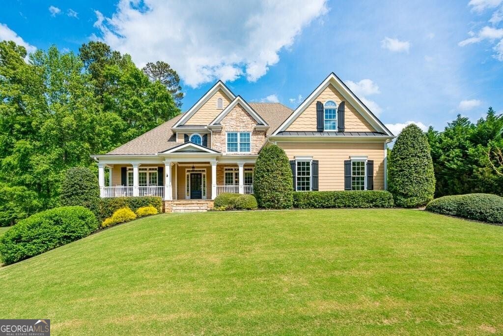 a front view of a house with yard