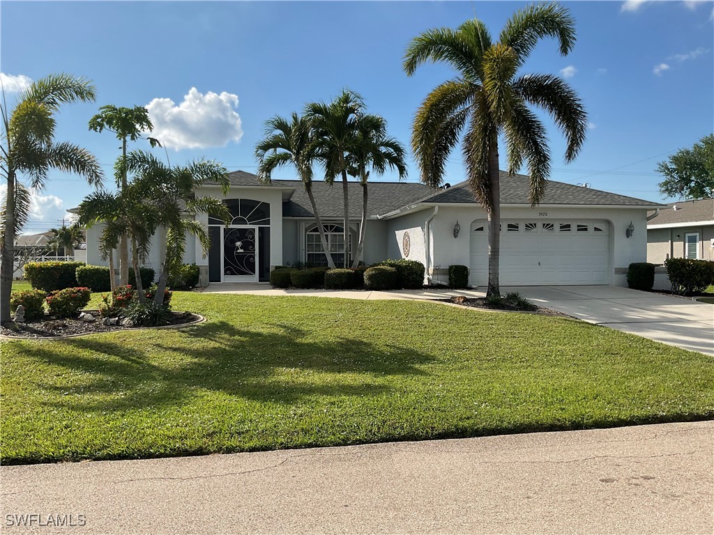 a front view of house with yard and green space