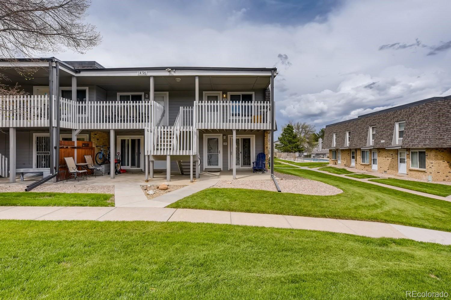 a view of a house with a yard patio and a patio