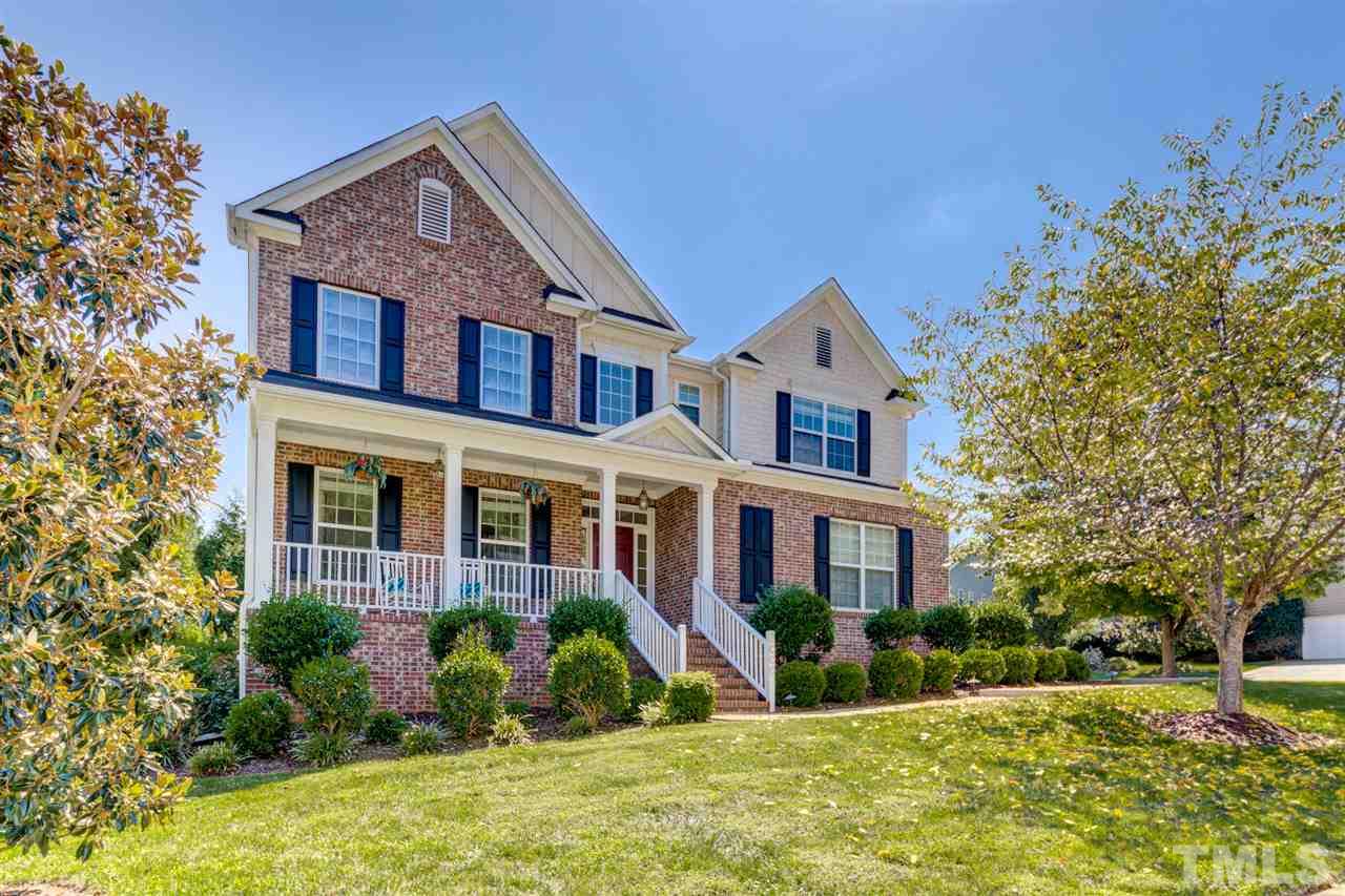 This stately two-story home sits on a corner lot and is packed with charm.