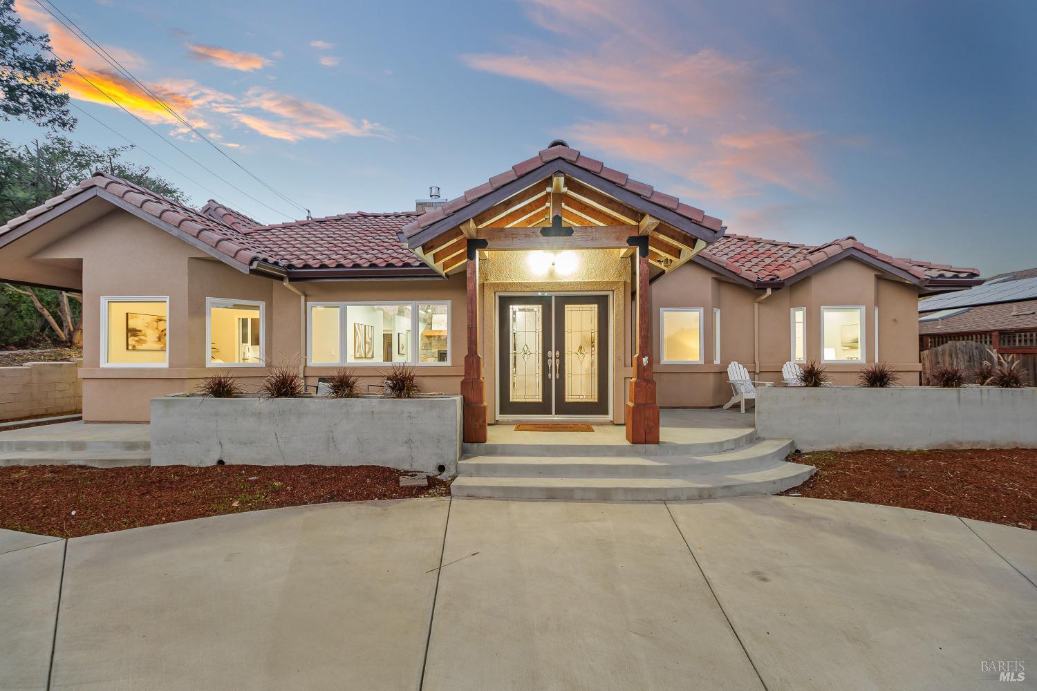 a front view of a house with a yard