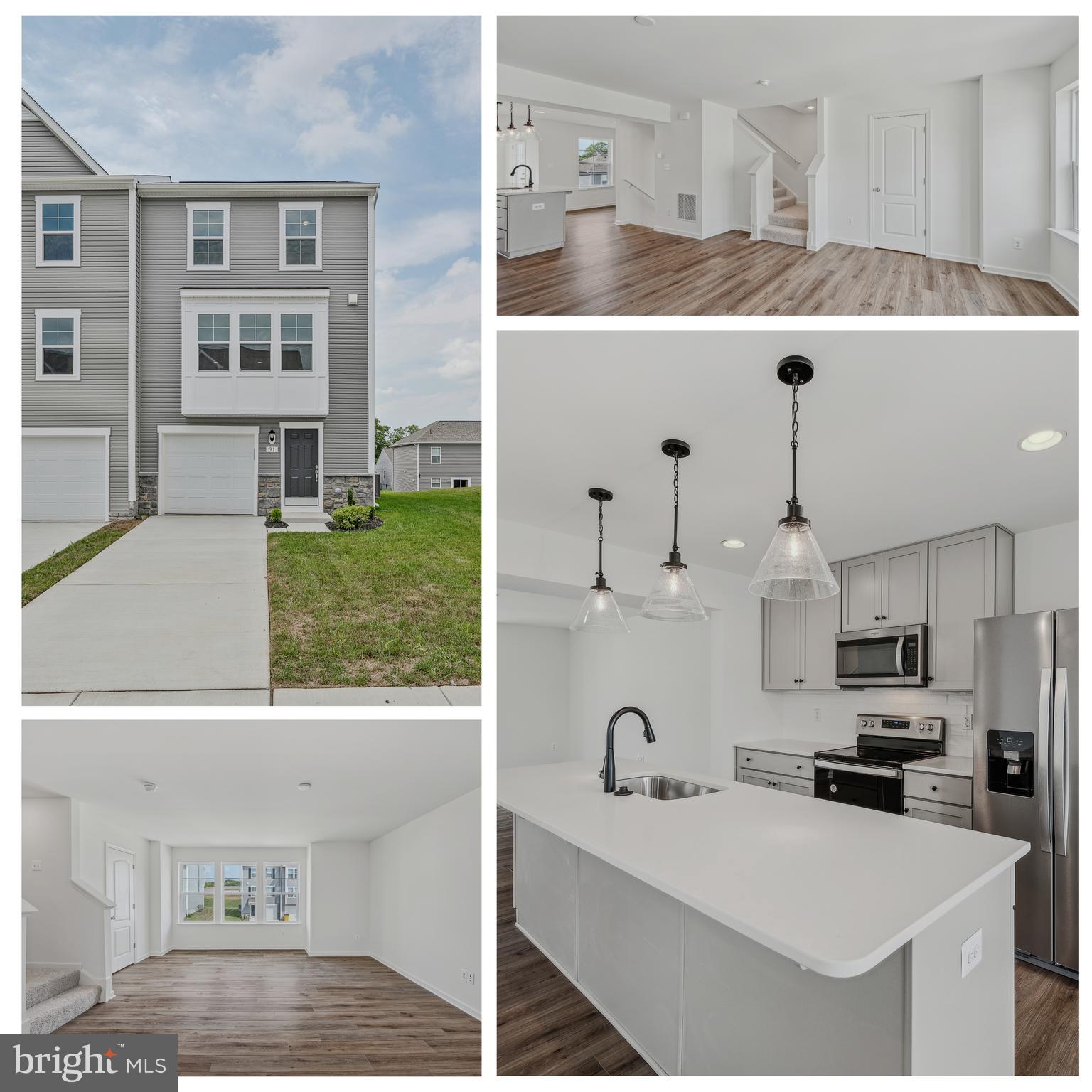 a kitchen with stainless steel appliances a sink a stove a refrigerator cabinets and living room view