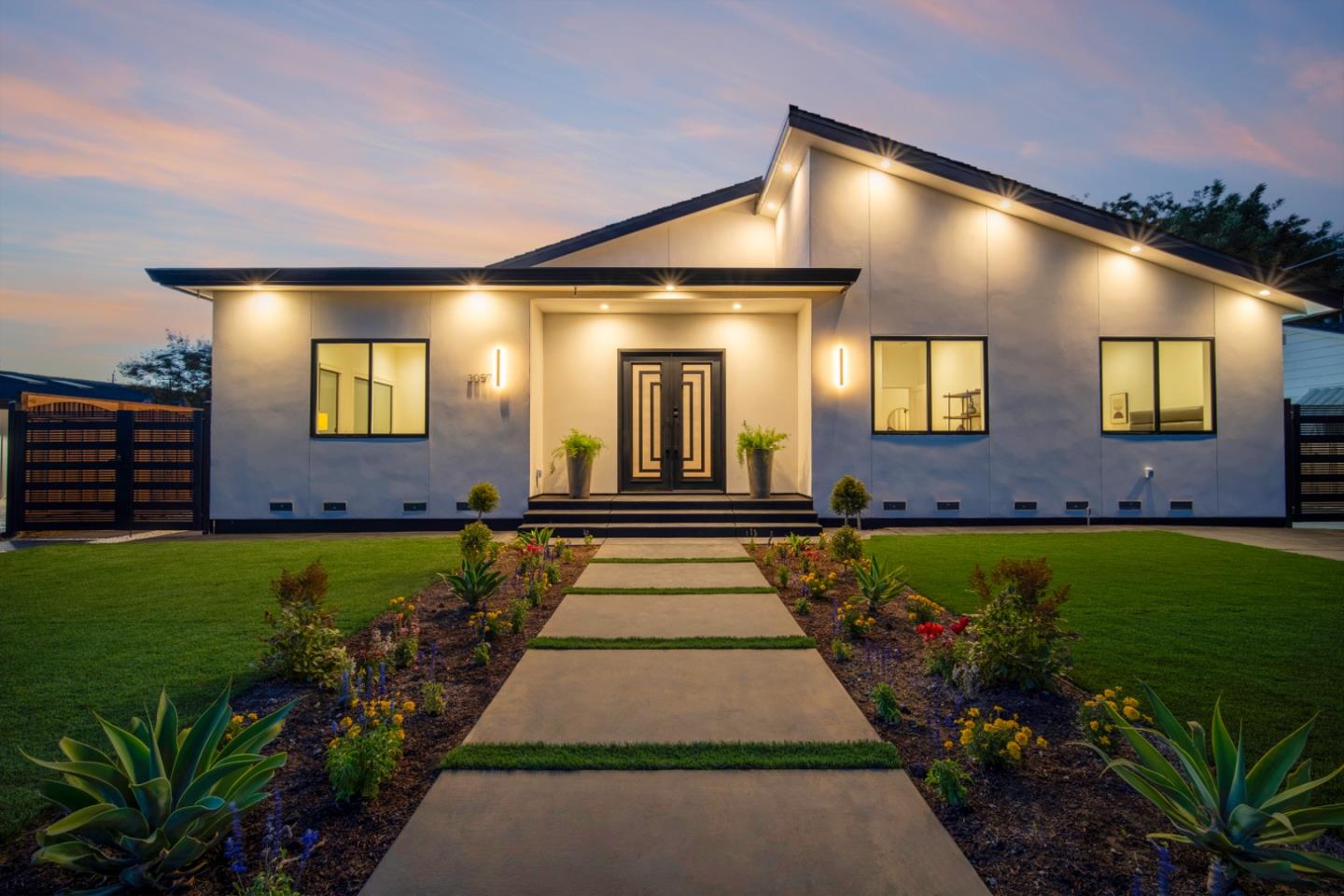 a front view of a house with a yard