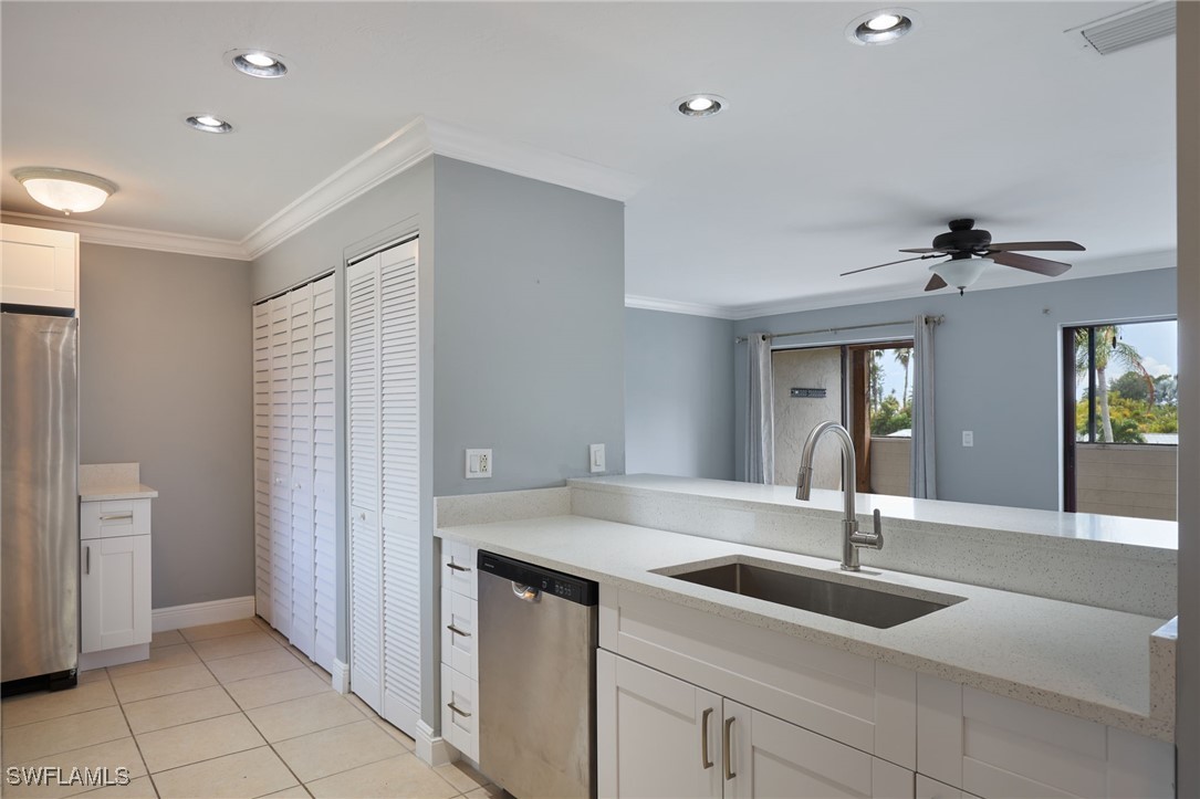 a kitchen with a sink and stove