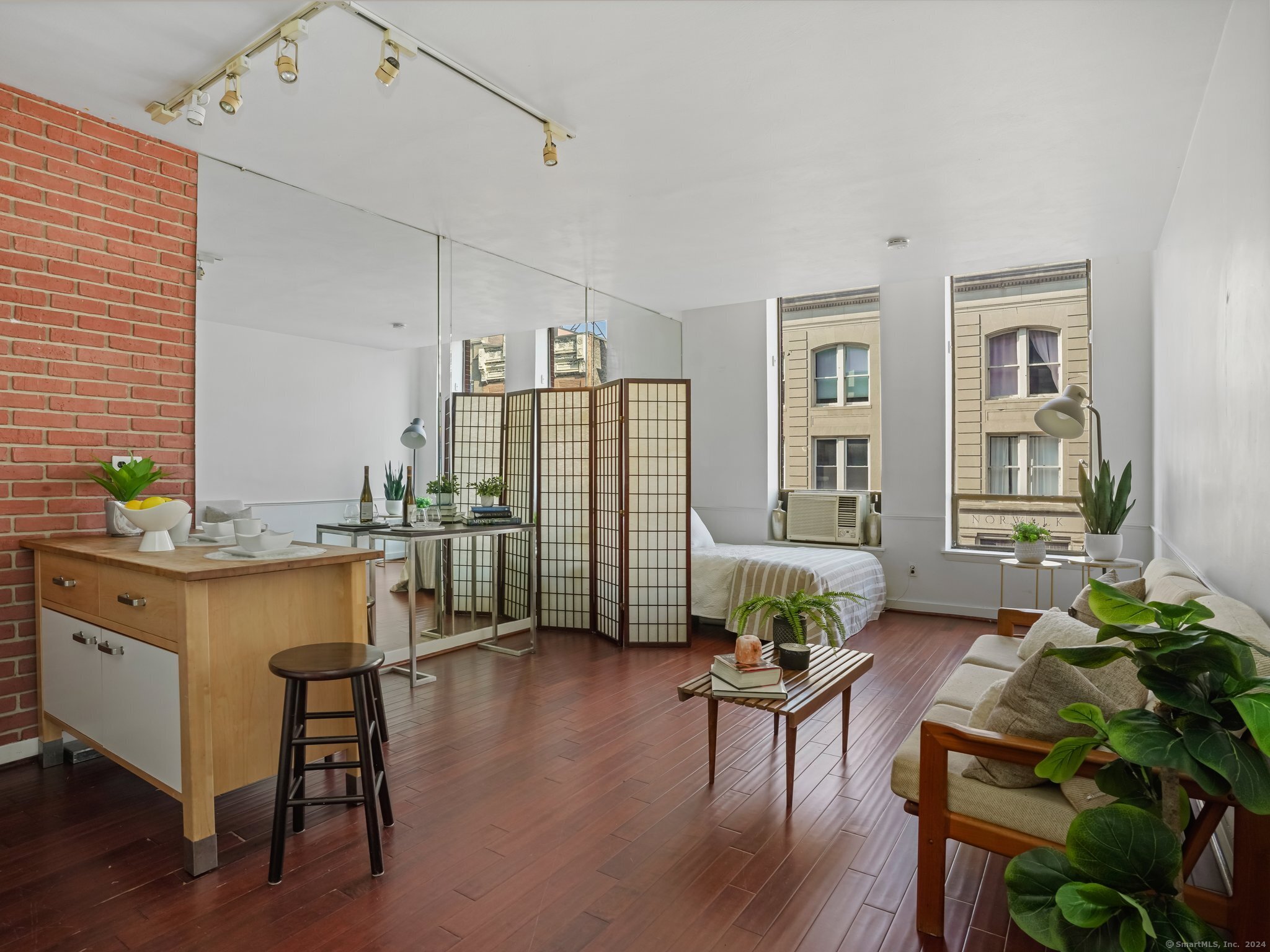 a living room with furniture and a table