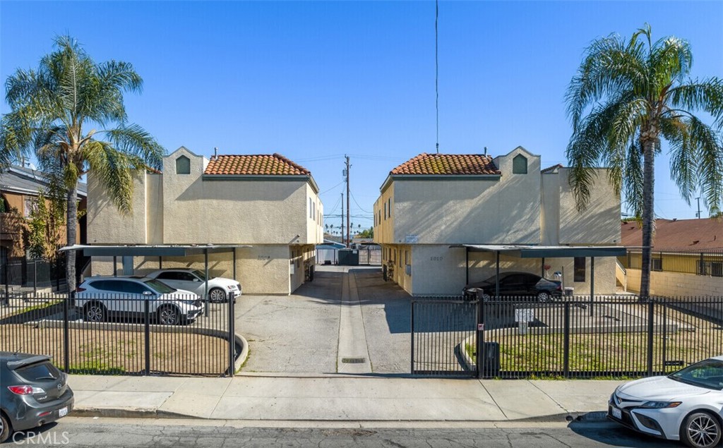 a car parked in front of house with a yard