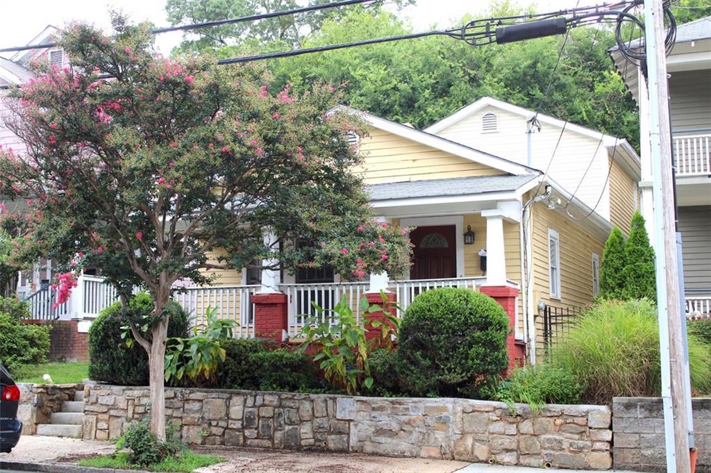 a view of house with outdoor space and sitting space