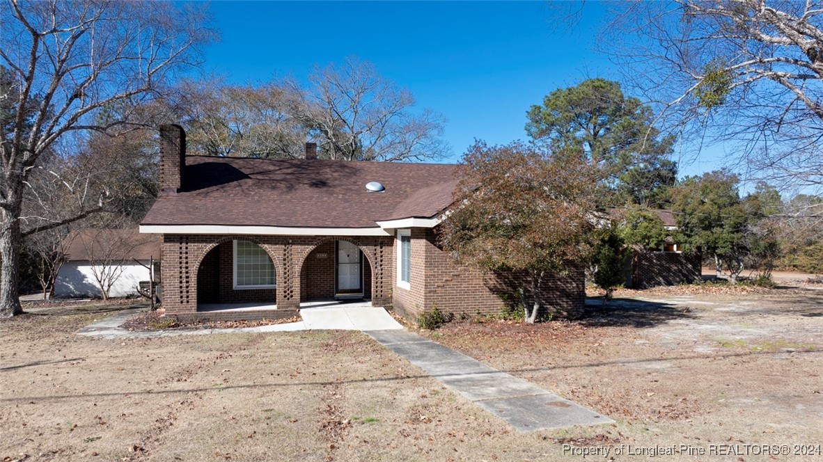 front view of a house with a yard