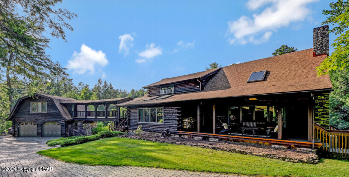 a view of a house with a yard porch and furniture