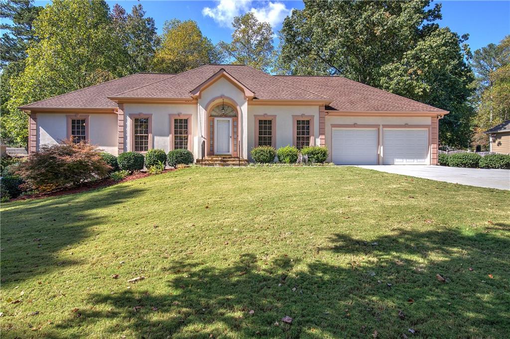 a front view of a house with a yard