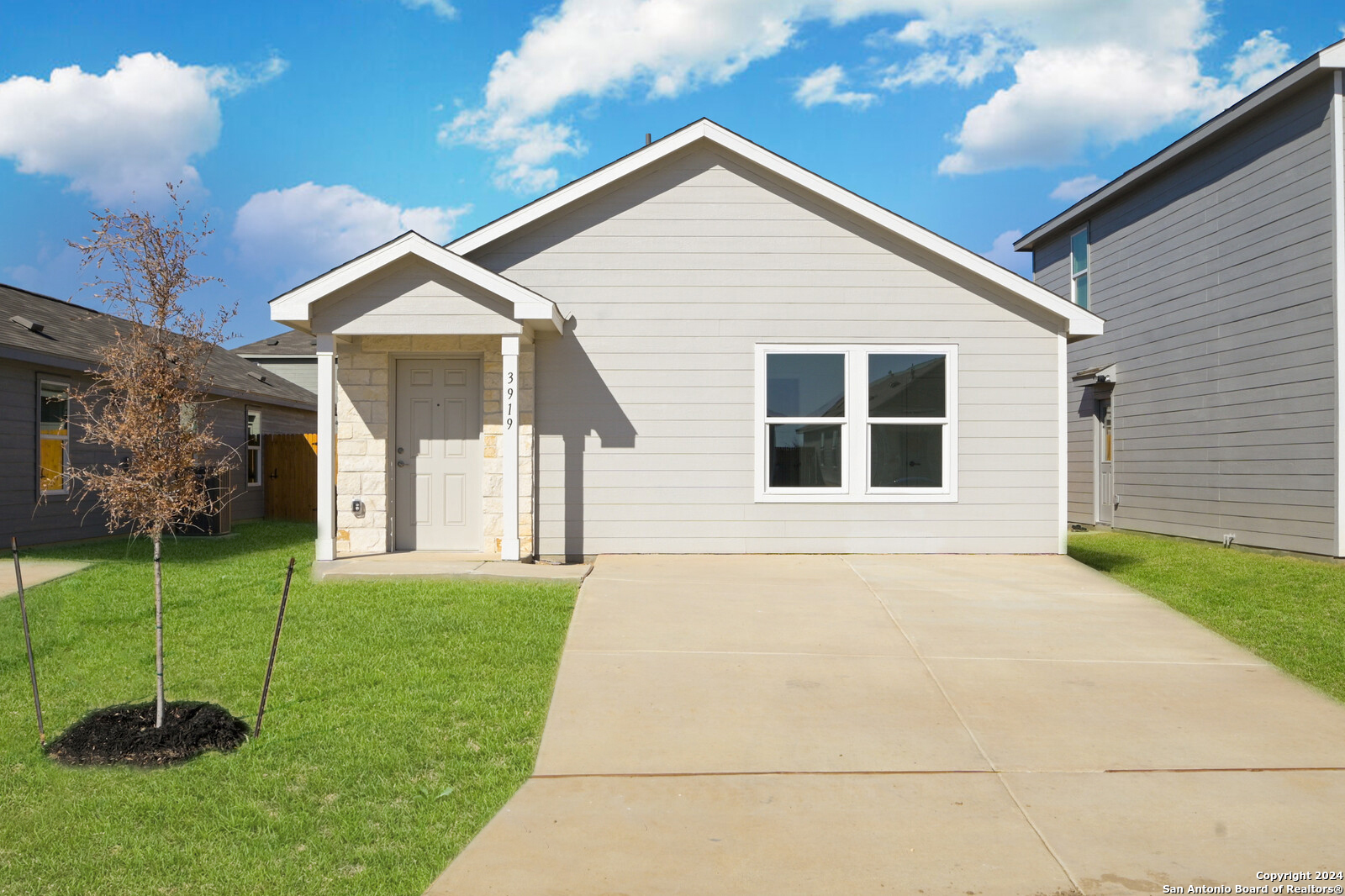 a front view of a house with a yard