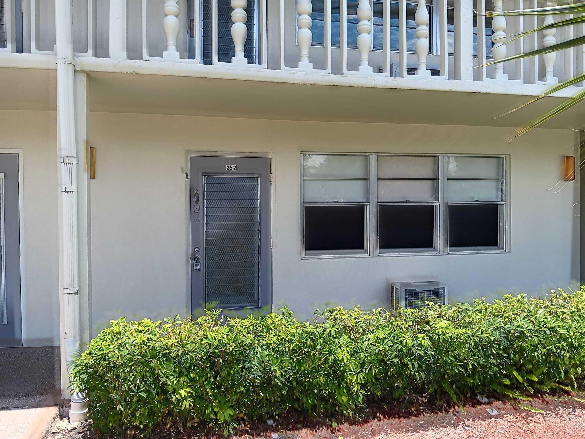 a house with potted plant in front of it