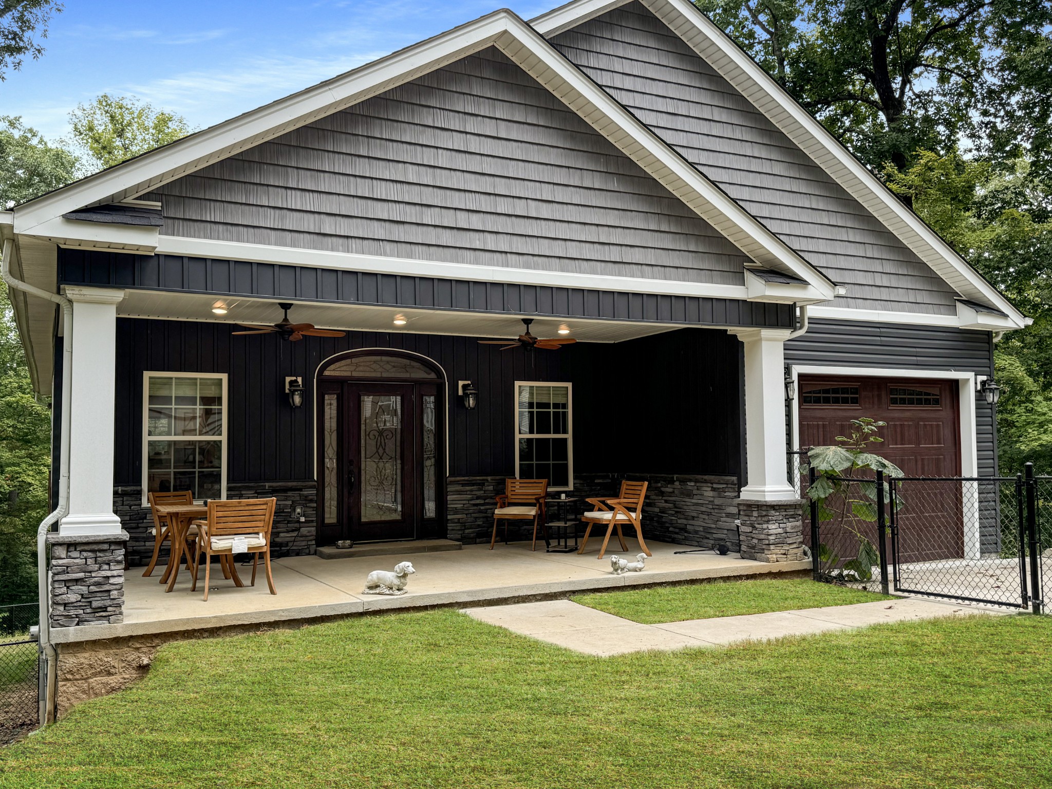 a view of a lounge chairs in patio with a barbeque