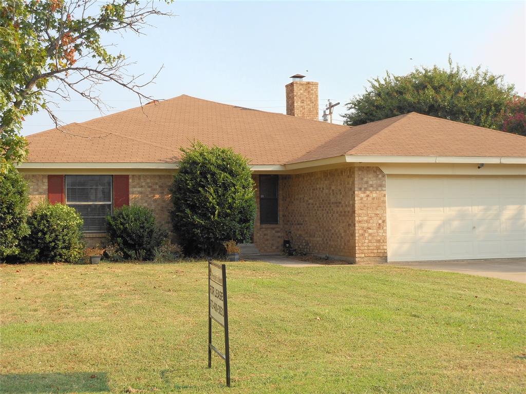 a front view of a house with yard