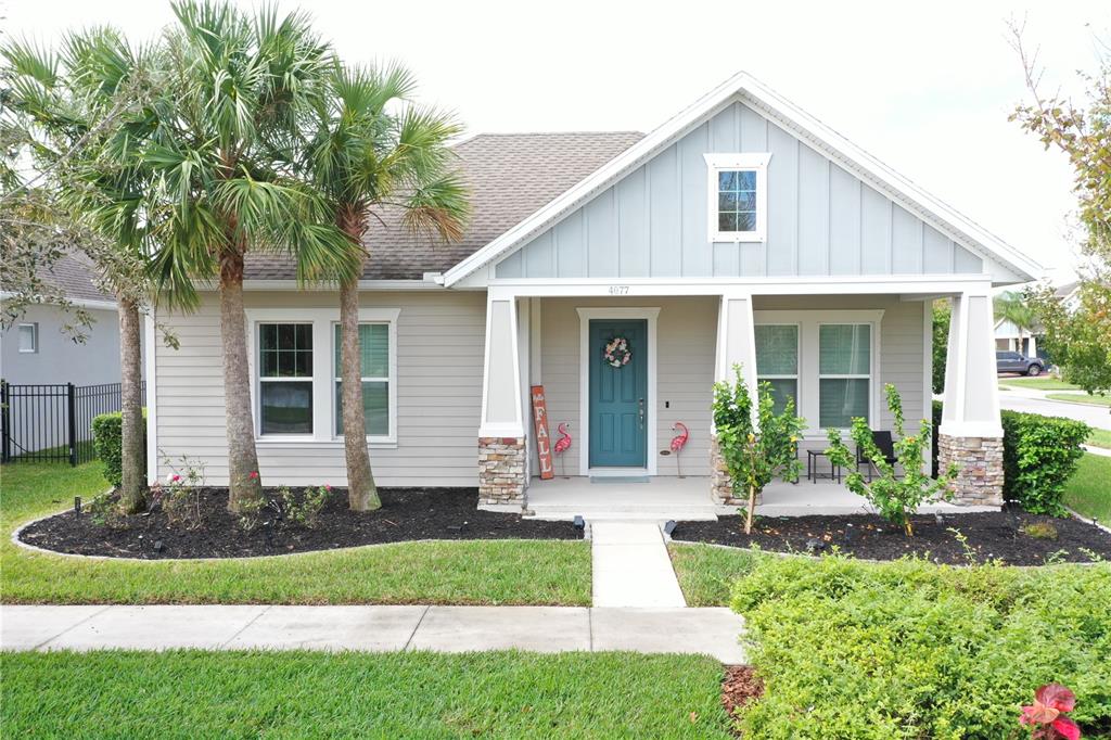 a front view of a house with garden and porch