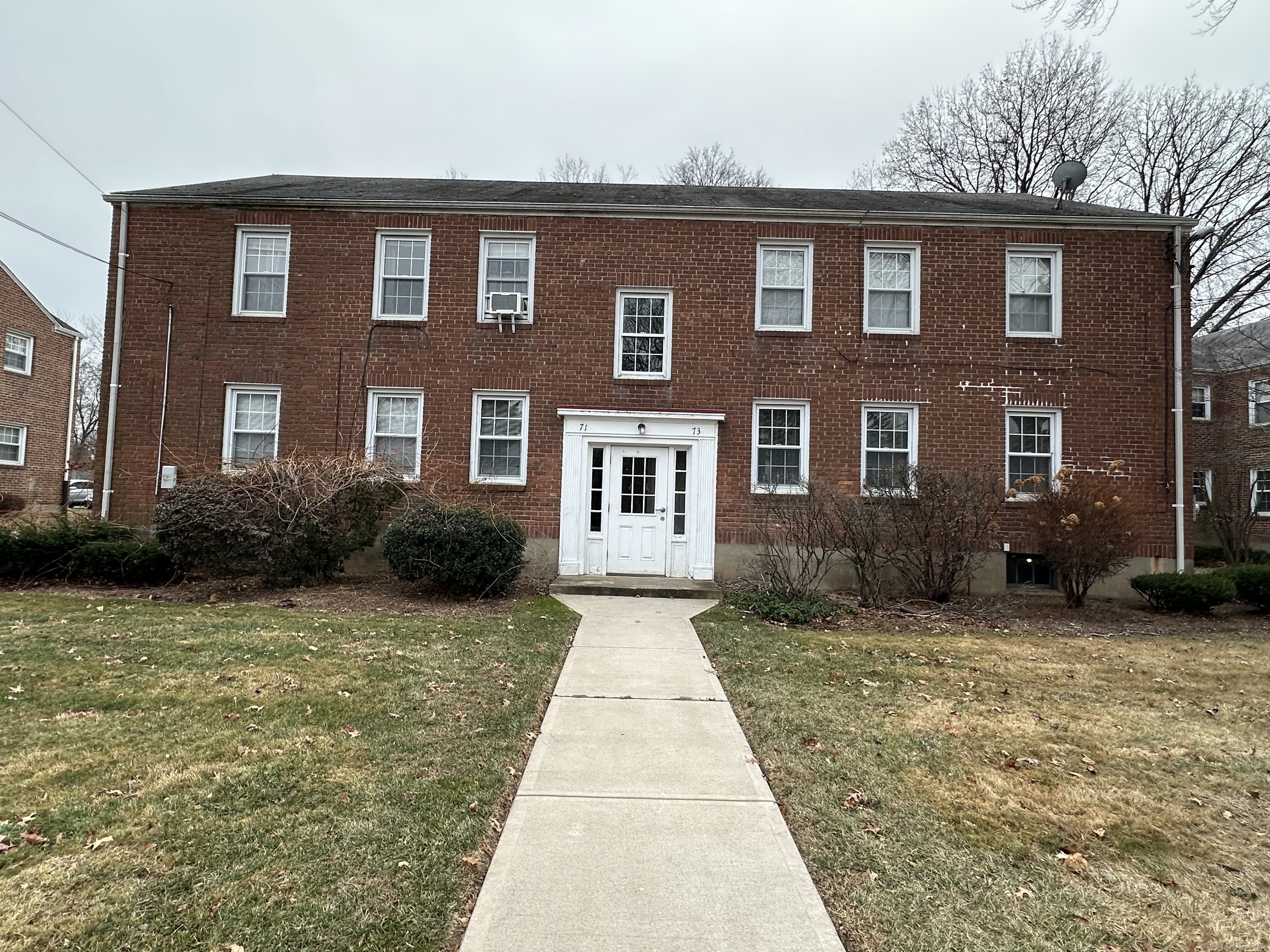 a front view of a house with yard