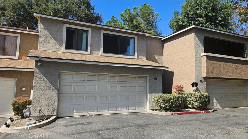 a front view of a house with a garage