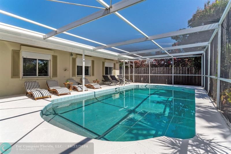 a view of a backyard with sitting area and furniture