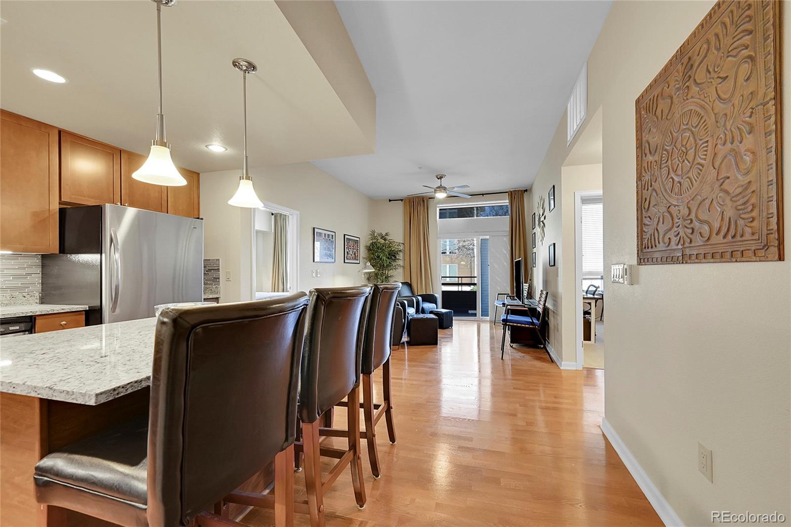 a dinning room with furniture and wooden floor