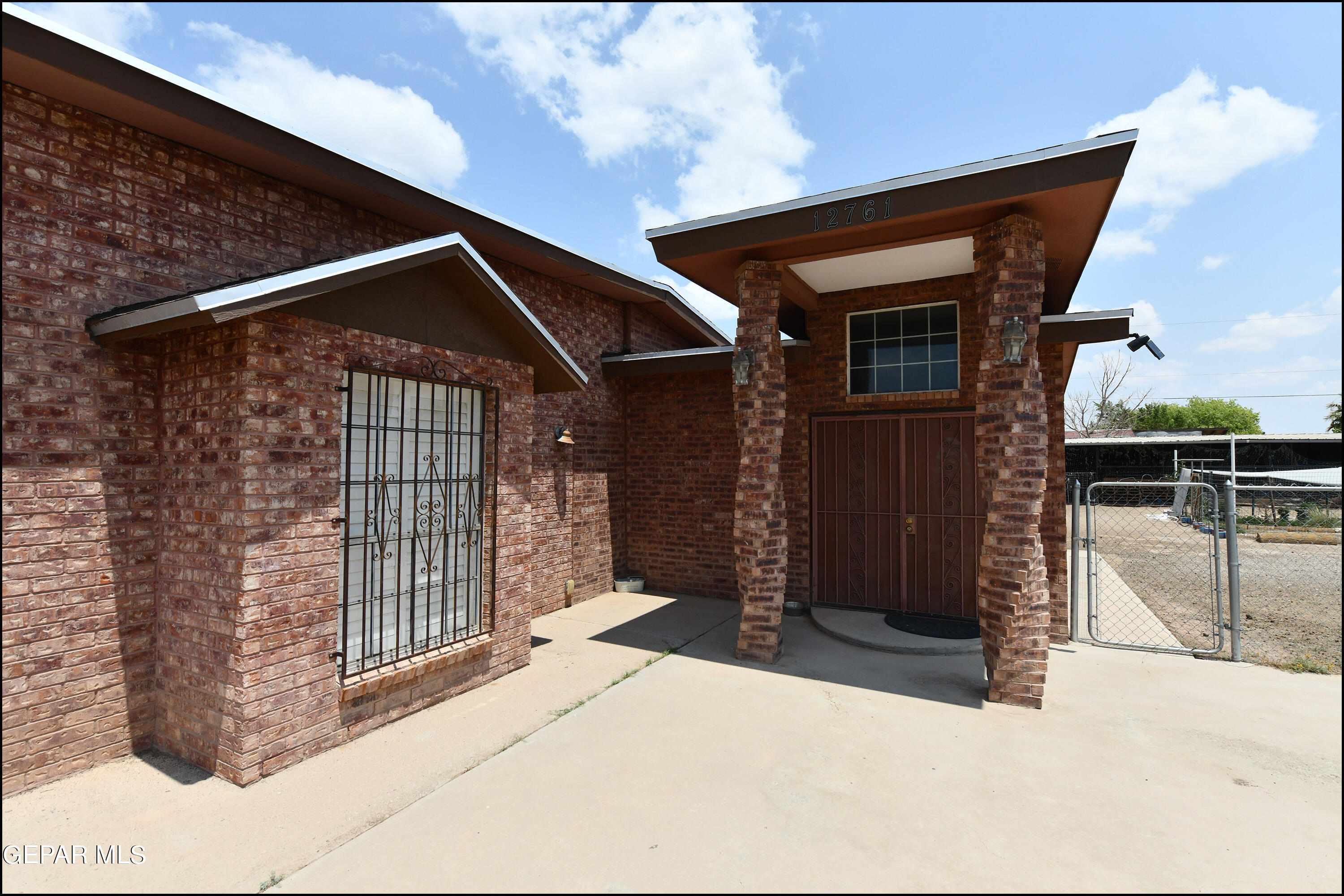 a front view of a house with garage