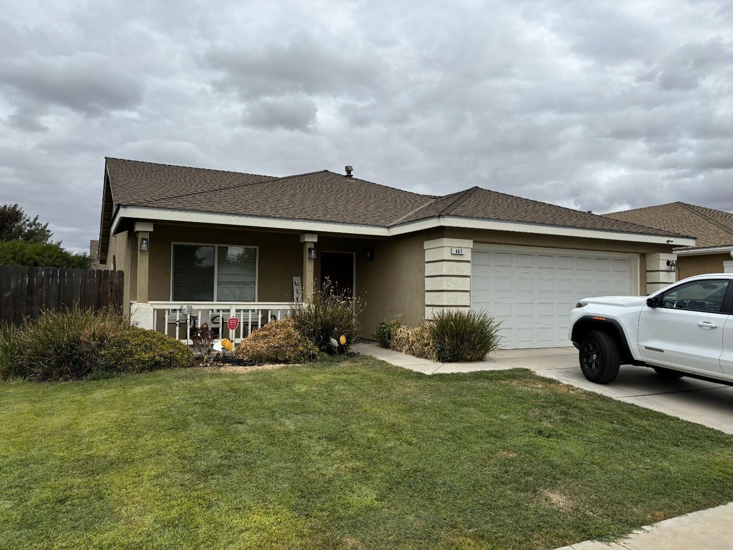 a view of house with backyard outdoor seating and barbeque oven