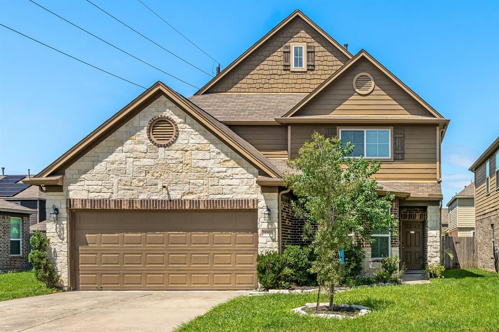 Welcome home to this beautiful stone and brick two-story residence, perfectly situated on a cul-de-sac.