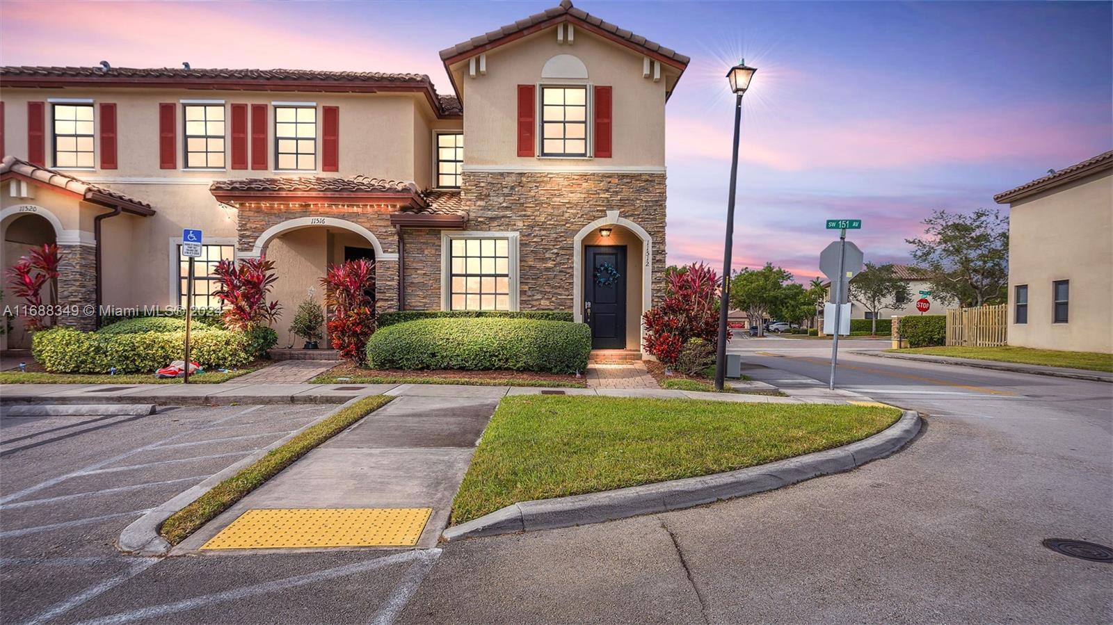 a front view of a house with yard