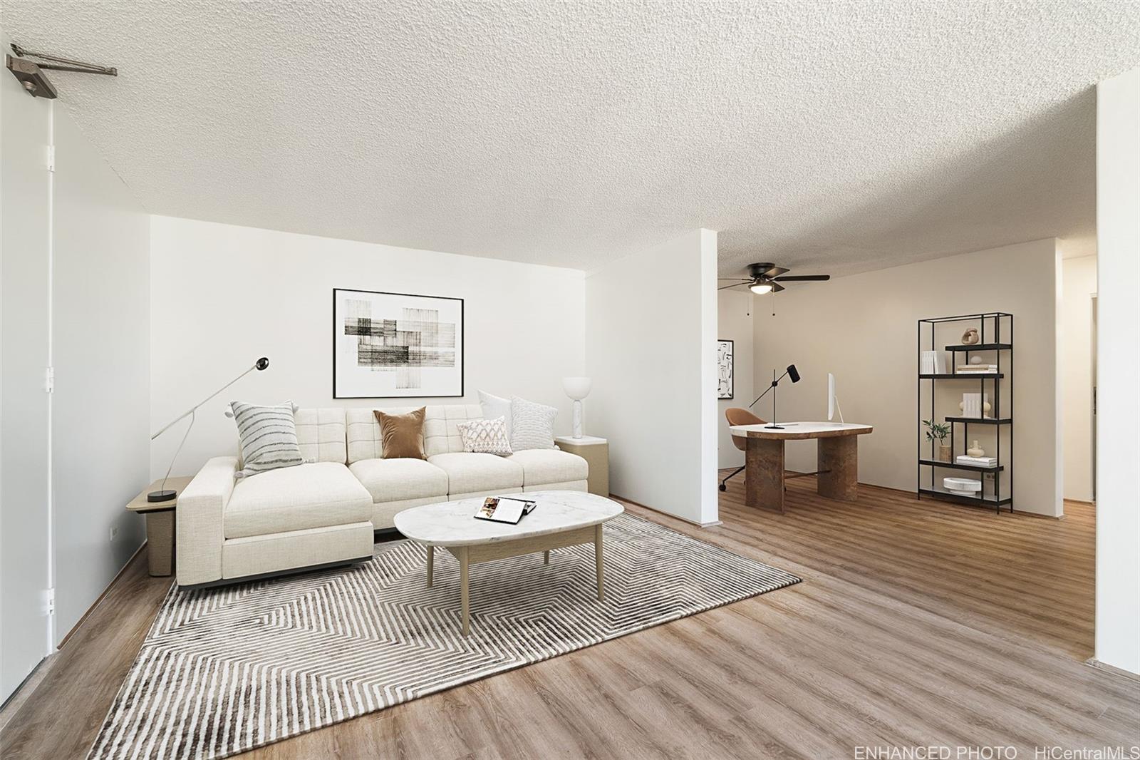 a living room with furniture and wooden floor