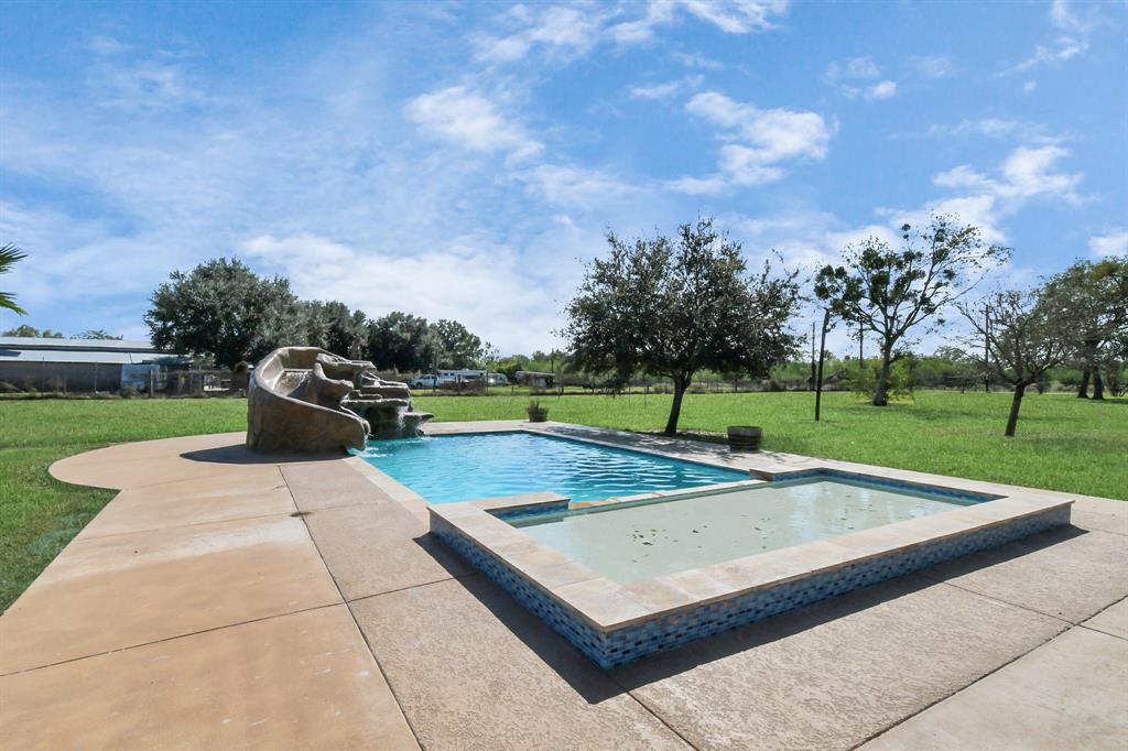 a view of a swimming pool with a patio