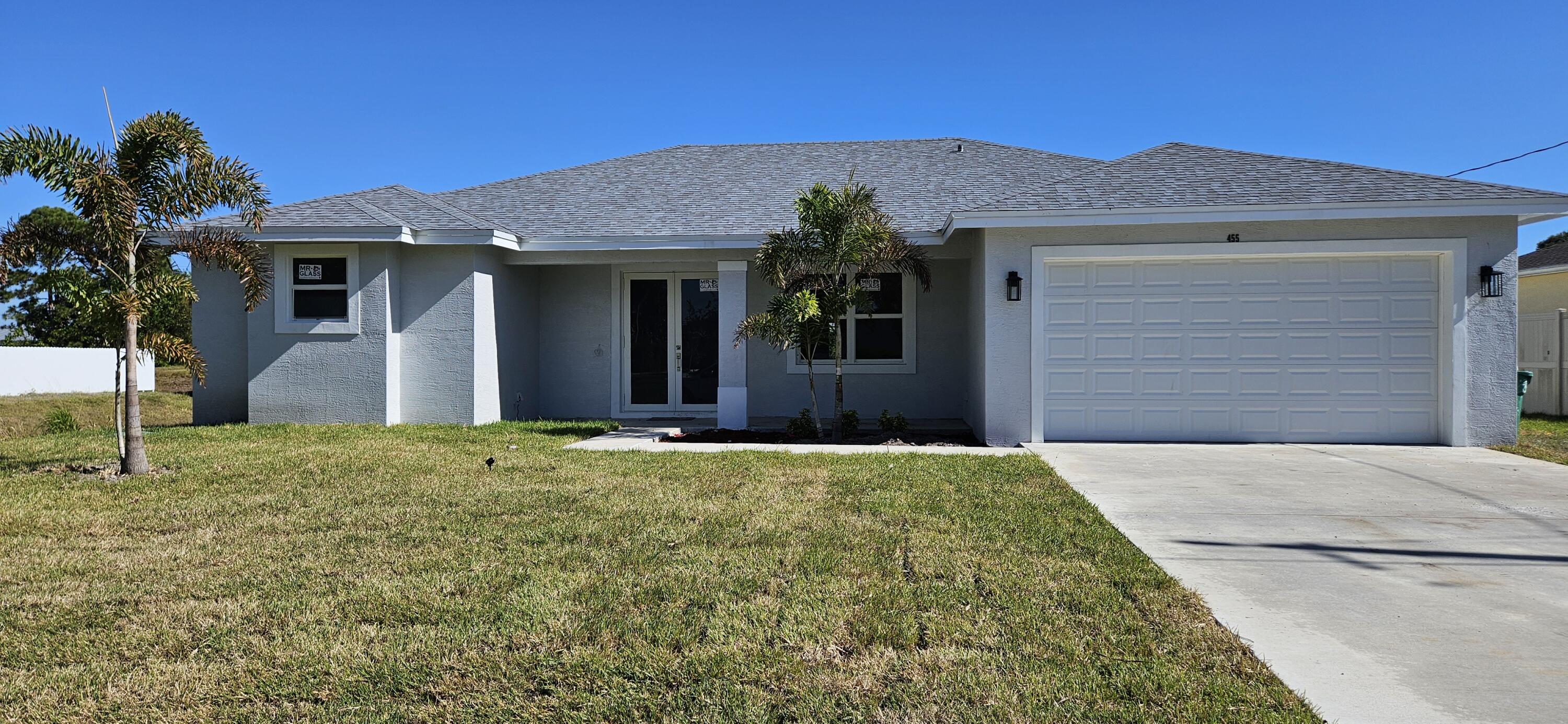 front view of a house with a yard