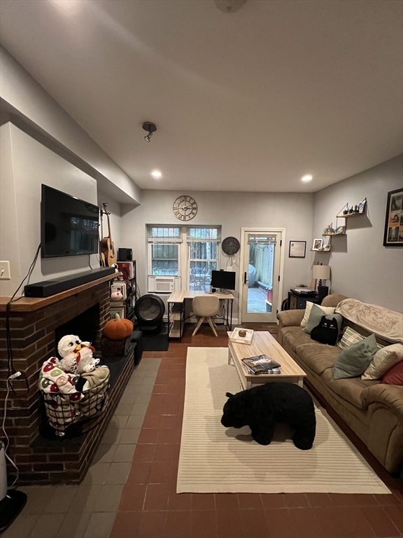 a bed room with furniture and a flat screen tv