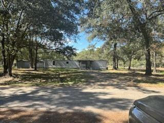 a view of a yard with a tree