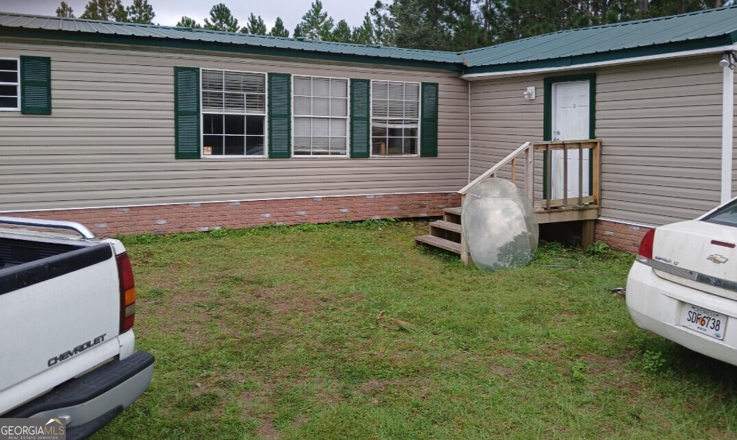 a view of a backyard with a garden