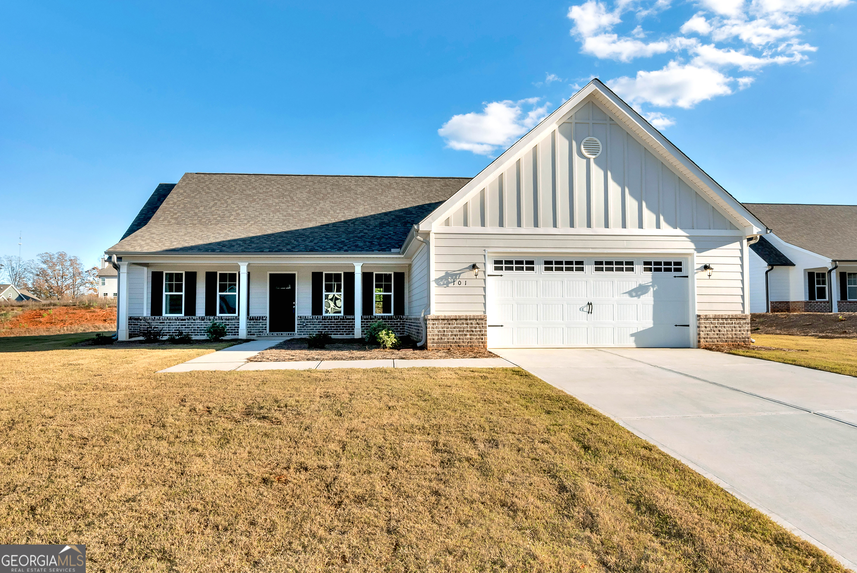 a front view of a house with a yard