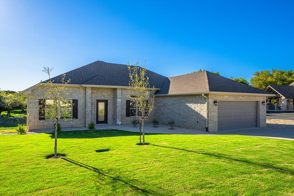 a view of a house with swimming pool and yard