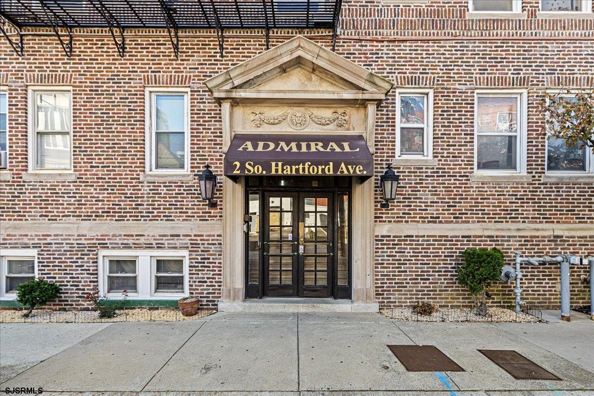 a view of entrance of a building with a street