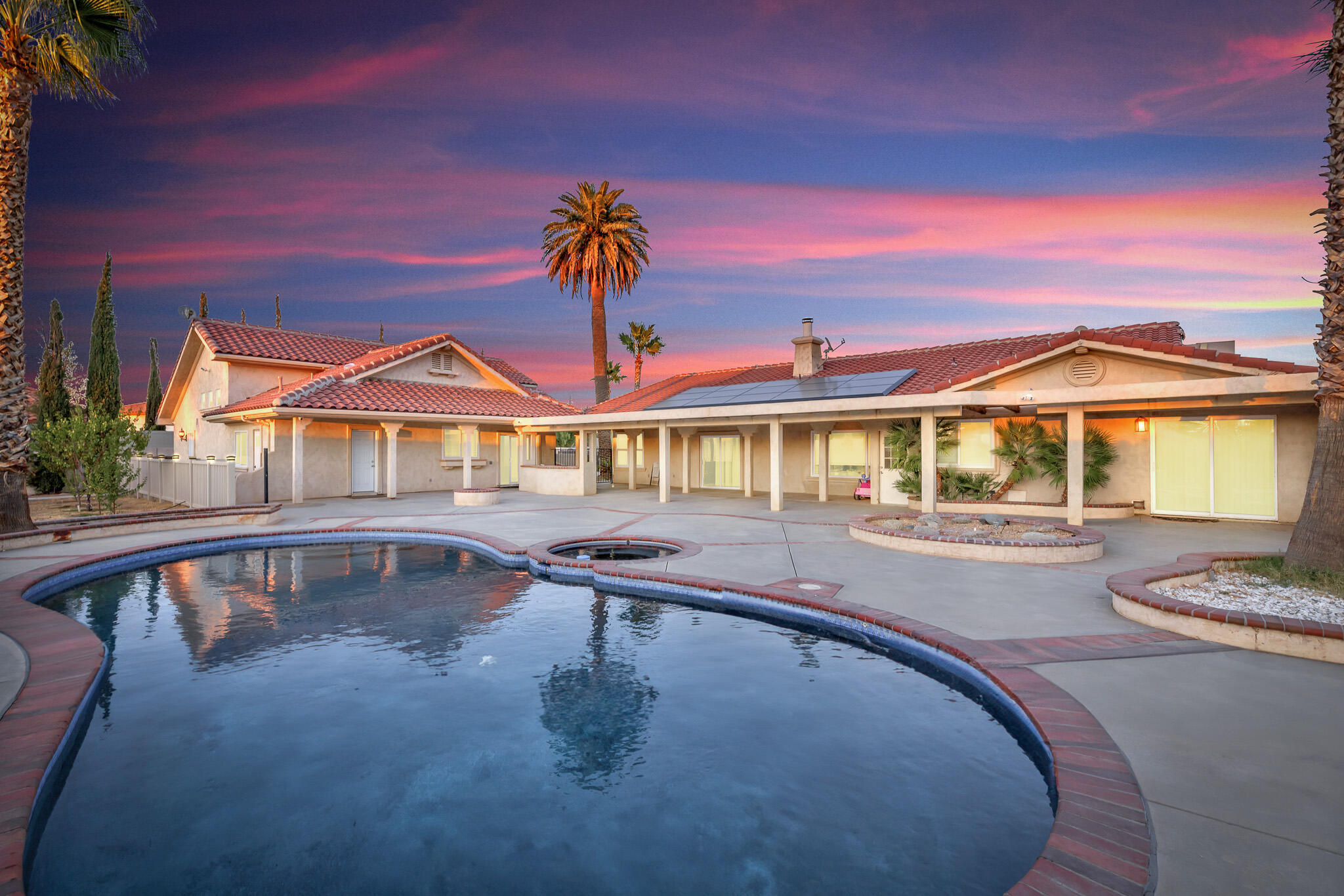 a swimming pool with outdoor seating