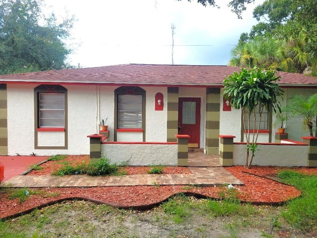 a front view of a house with garden