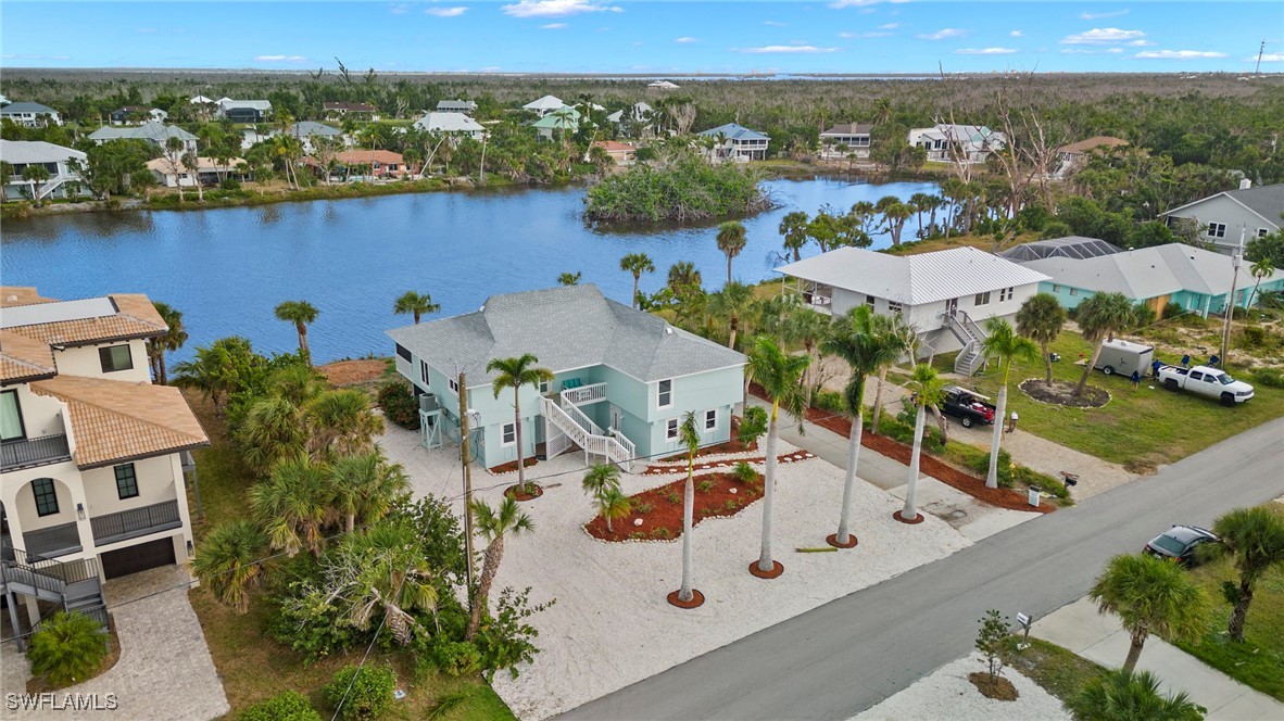 an aerial view of a house with swimming pool