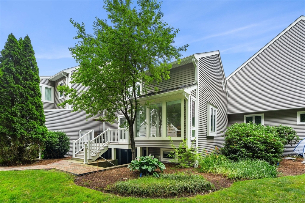 a view of an house with backyard space and garden