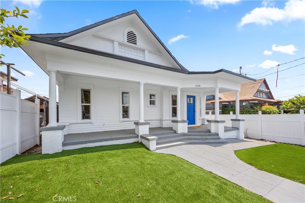 a view of an house with backyard porch and outdoor kitchen