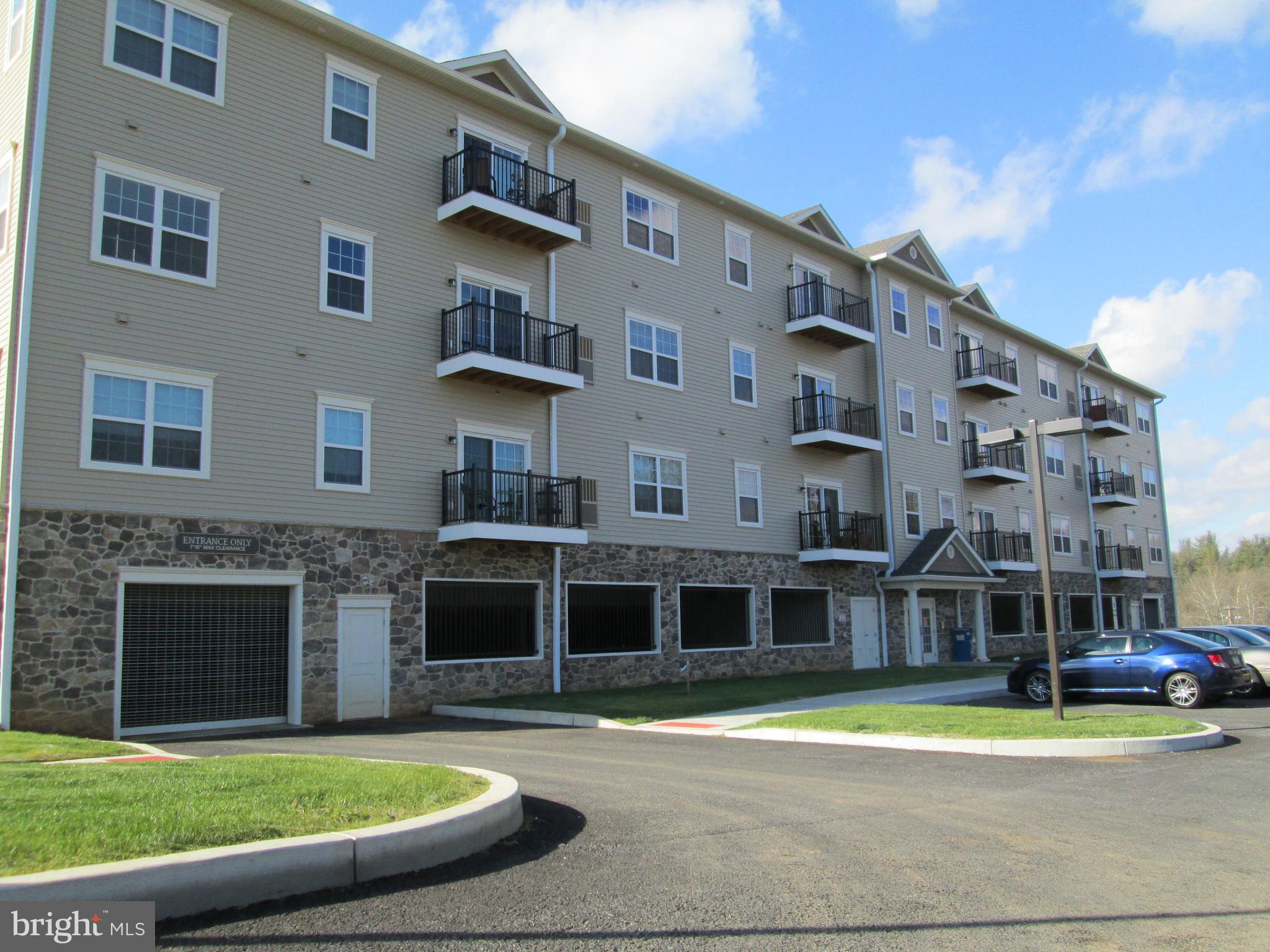 a view of building with yard in front of it