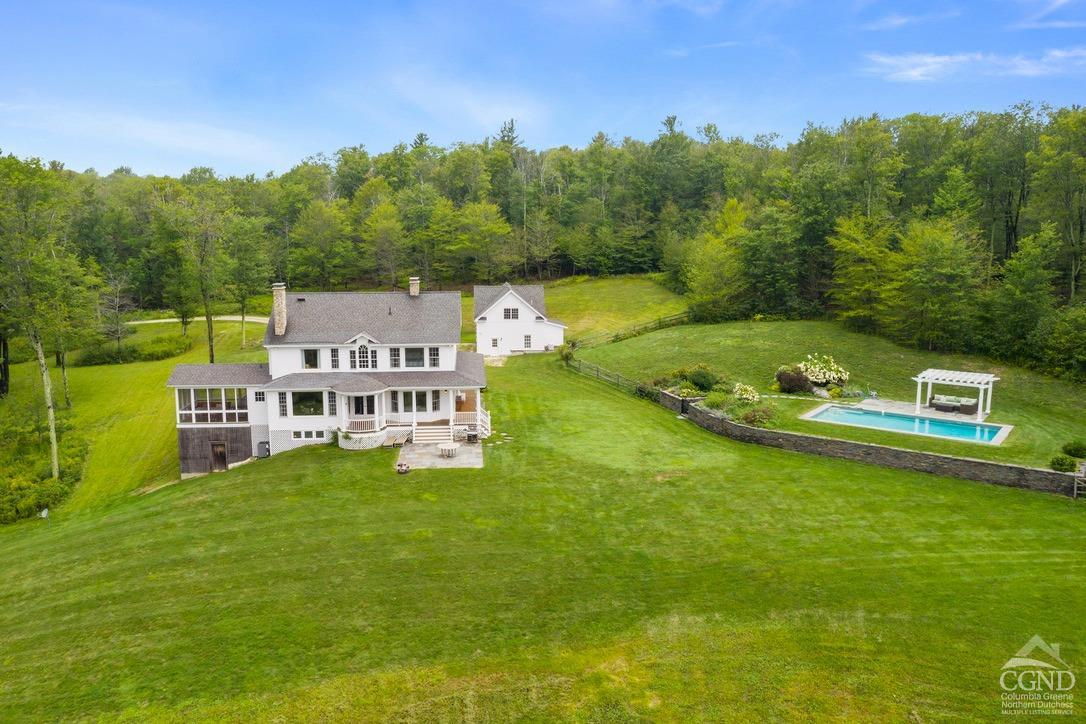 a view of a house with a big yard